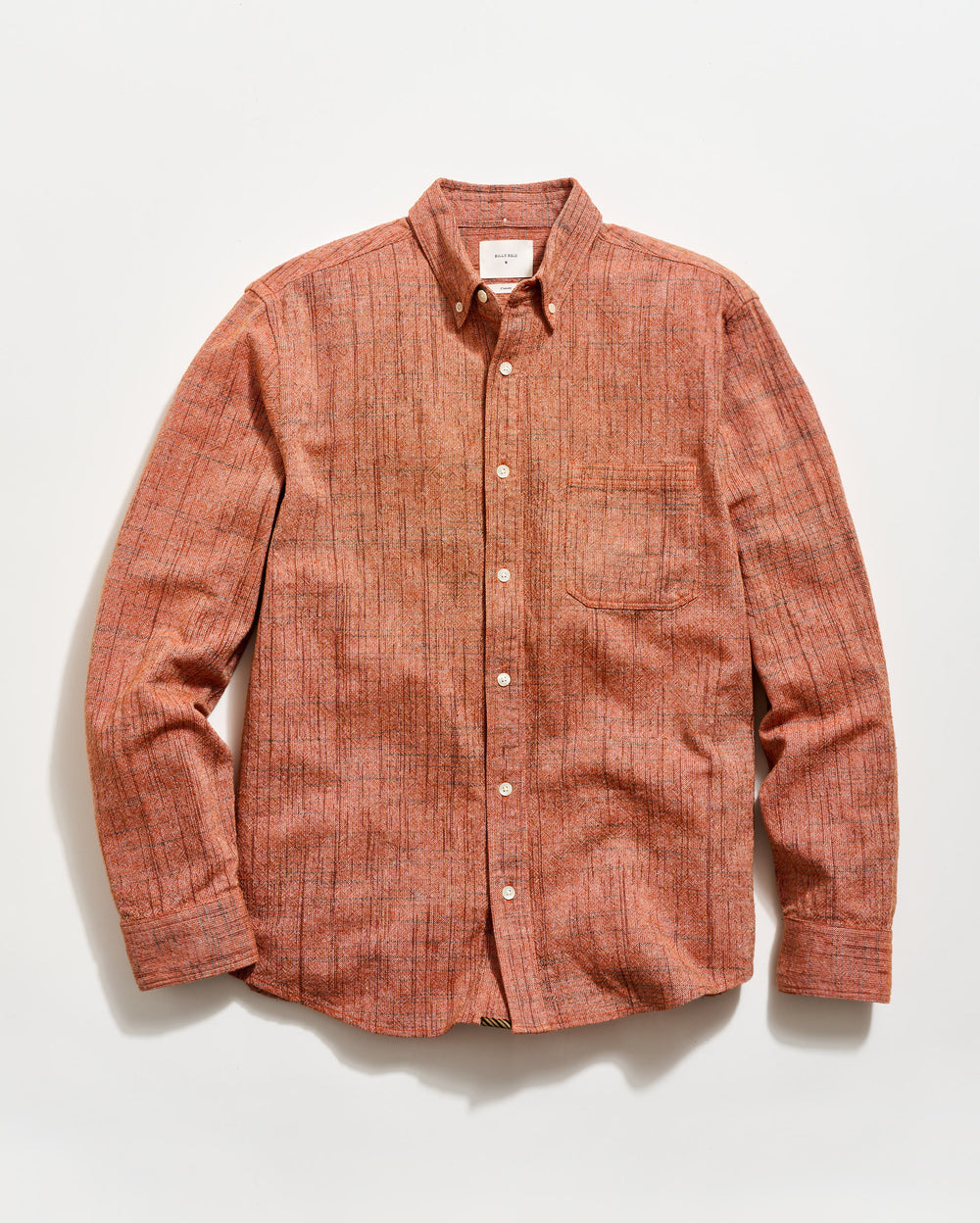 Brown checkered shirt on a white background