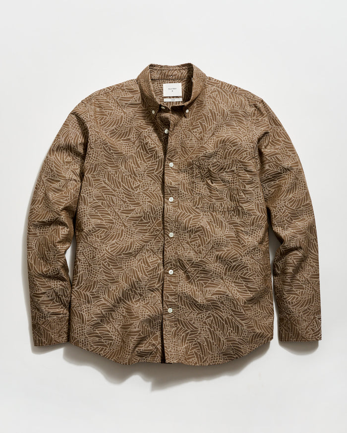 Brown patterned shirt on a white background