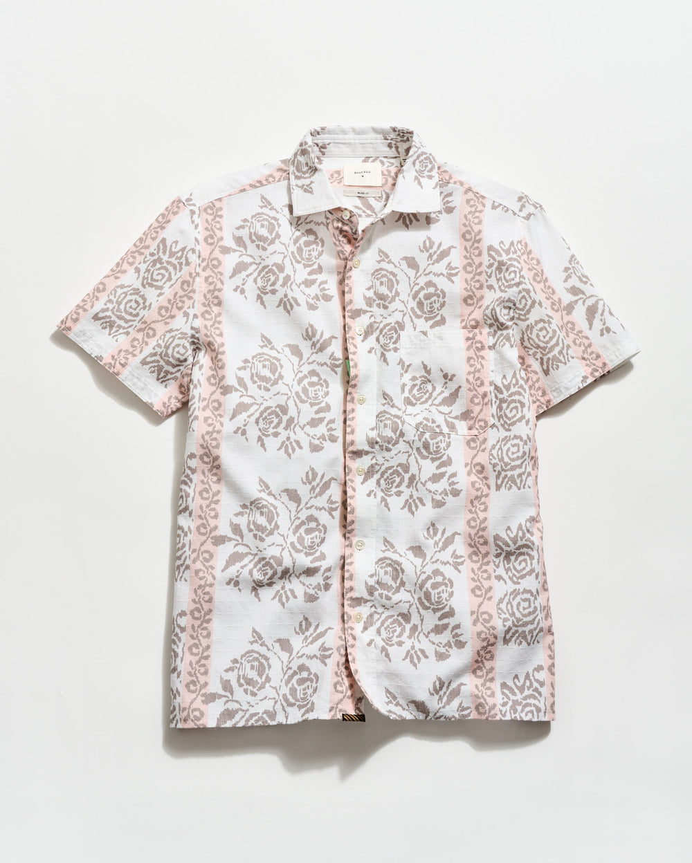 Short-sleeve shirt with floral pattern on a white background