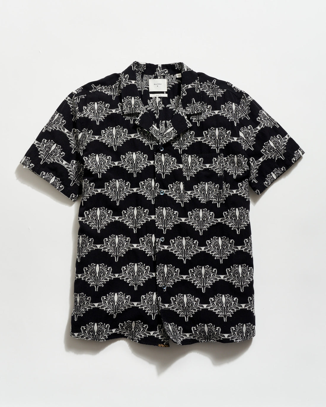 Black shirt with white geometric pattern on a white background