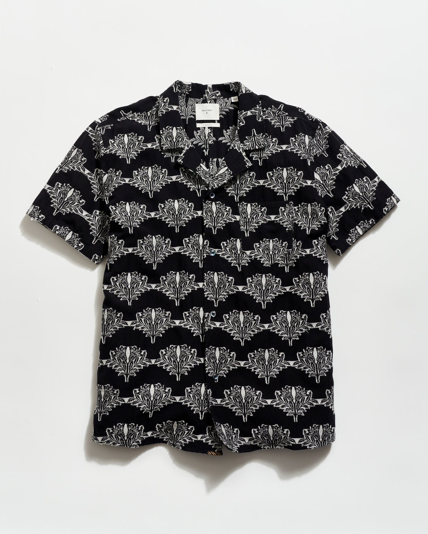 Black shirt with white geometric pattern on a white background