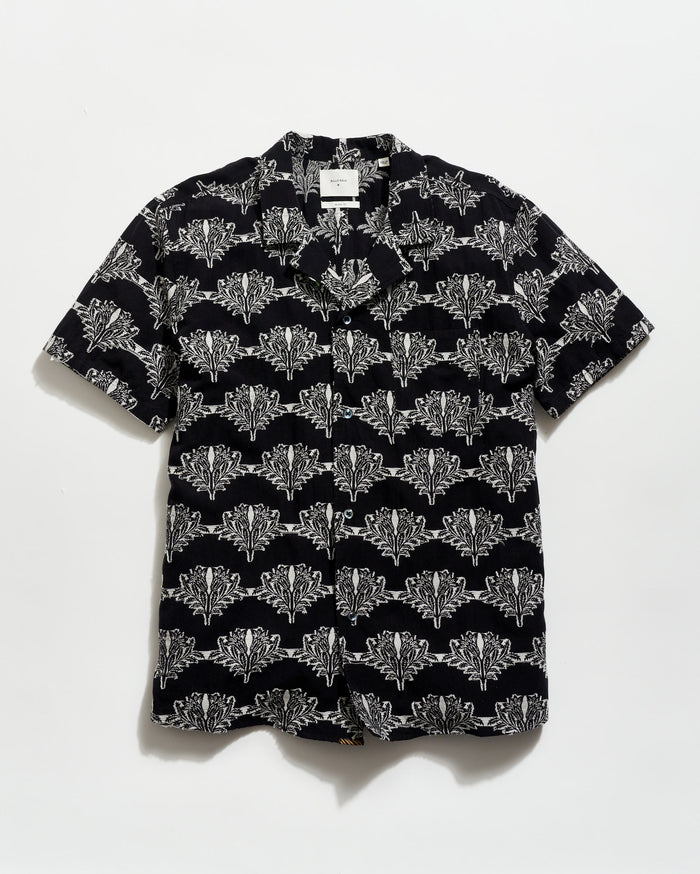 Black shirt with white geometric pattern on a white background