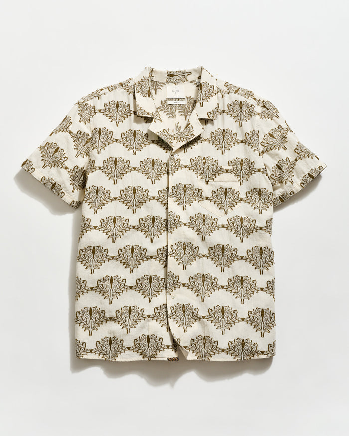 Short-sleeve shirt with a floral pattern on a light background