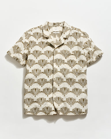 Short-sleeve shirt with a floral pattern on a light background