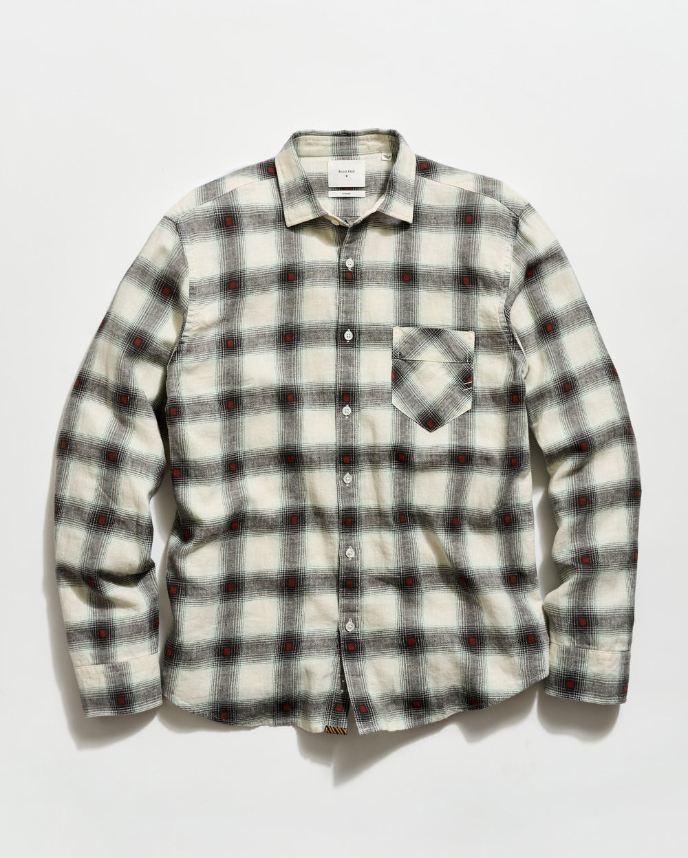 Plaid shirt with a pattern of black, red, and white on a light gray background