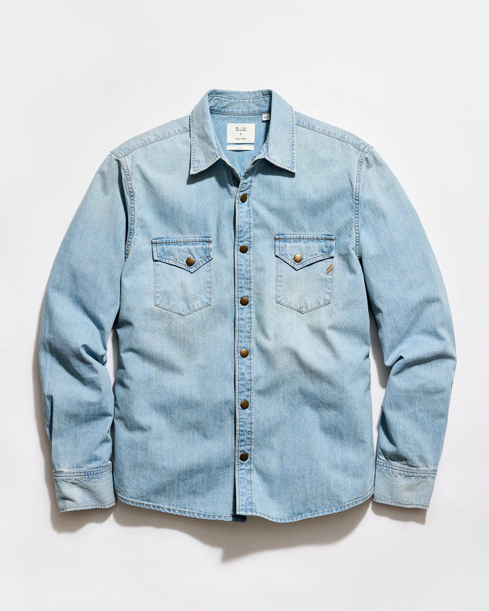 Light blue denim shirt on a white background