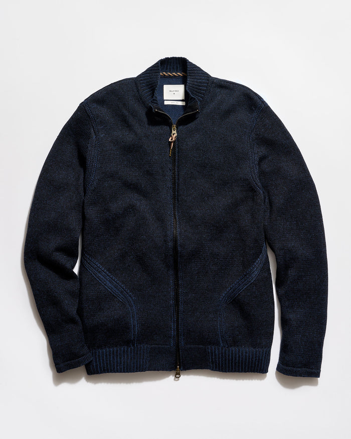 Dark blue zip-up sweater on a light gray background