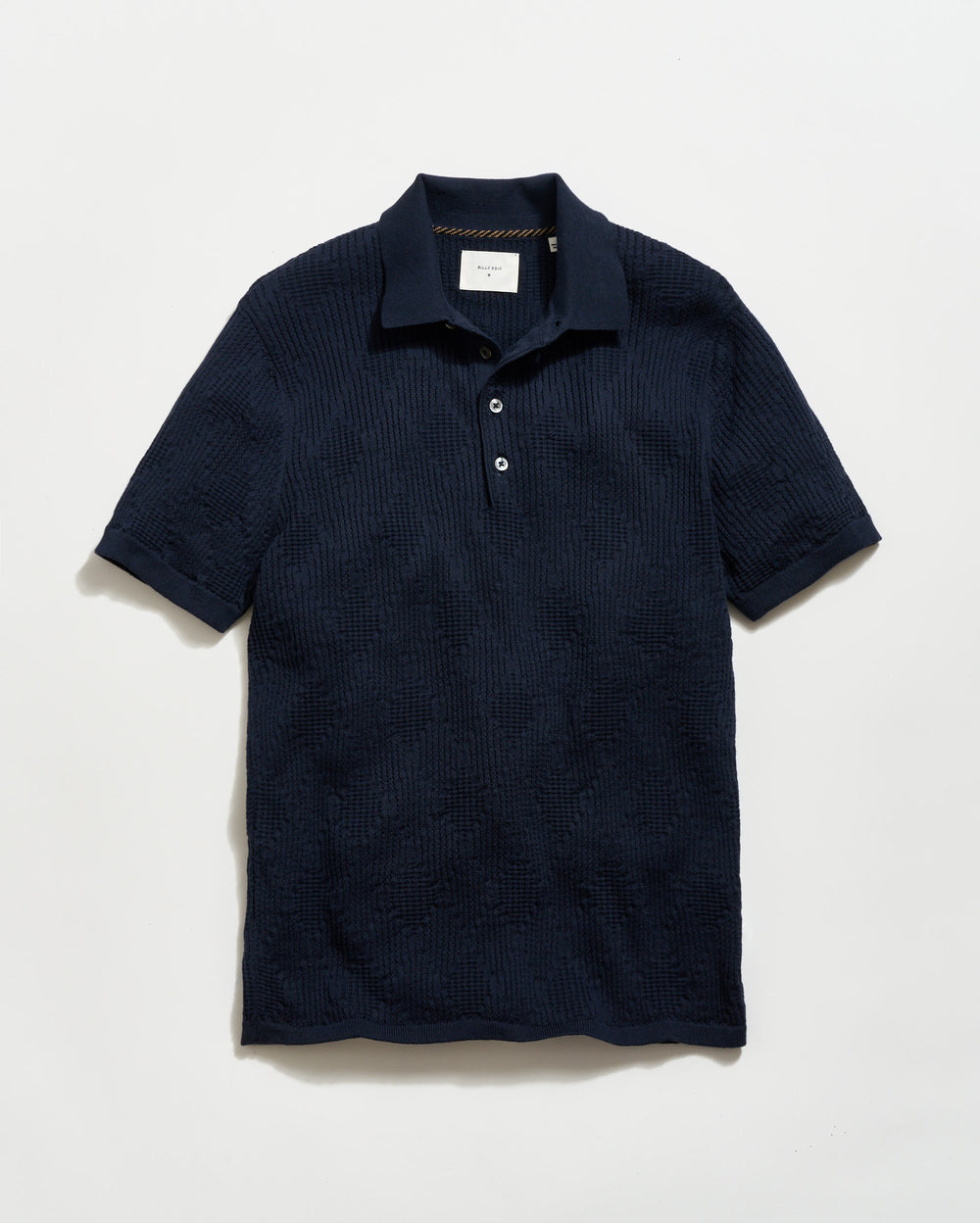 Navy textured polo shirt on a light gray background