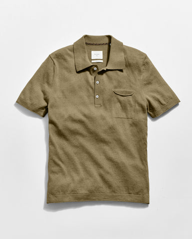 Green polo shirt on a light gray background
