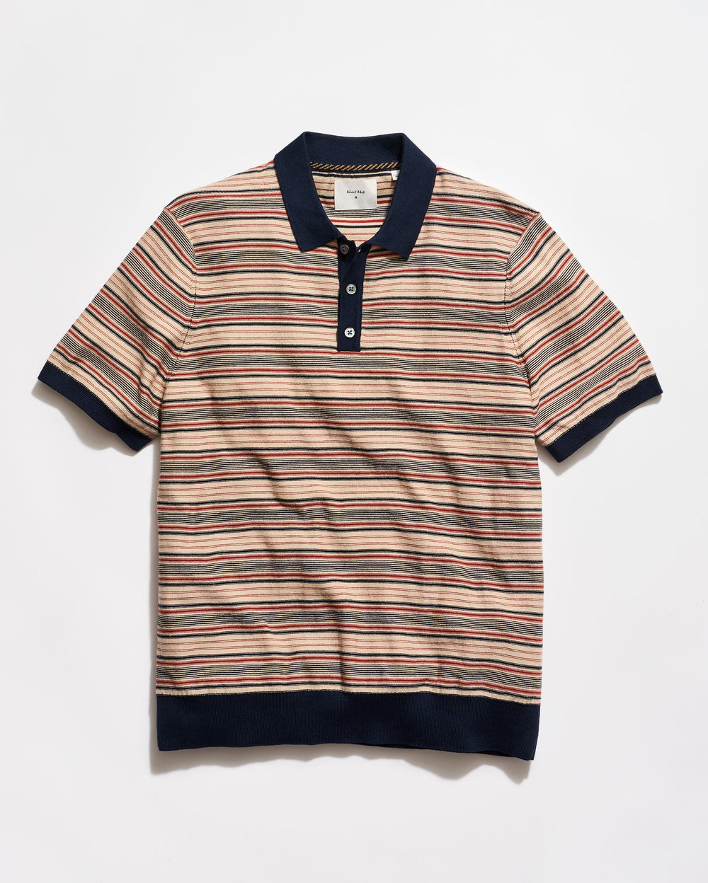 Striped polo shirt with navy accents on a light gray background