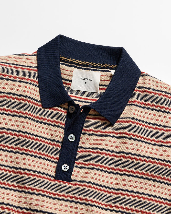 Striped polo shirt with a navy collar on a white background