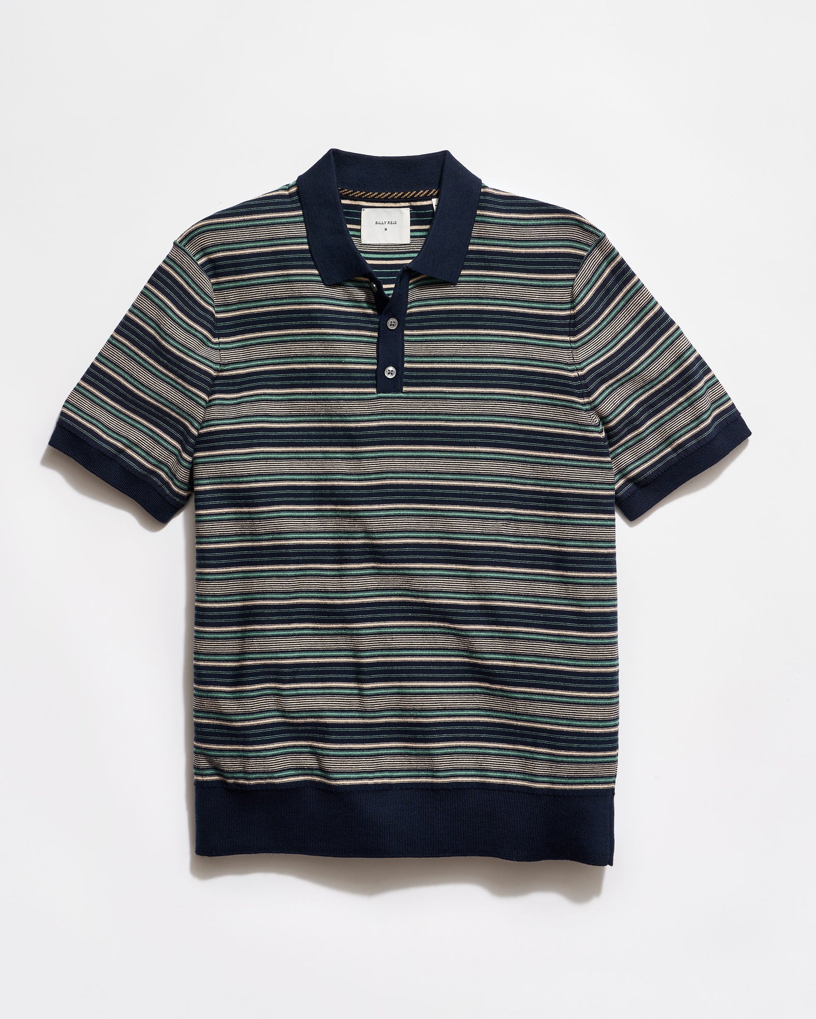 Striped polo shirt with navy collar and trim on a white background
