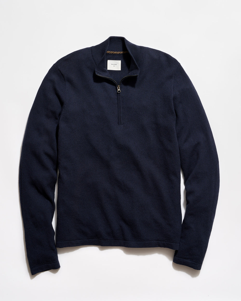 Navy blue pullover with a quarter zip on a light gray background