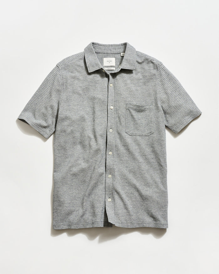 Gray striped short-sleeve shirt on a light gray background