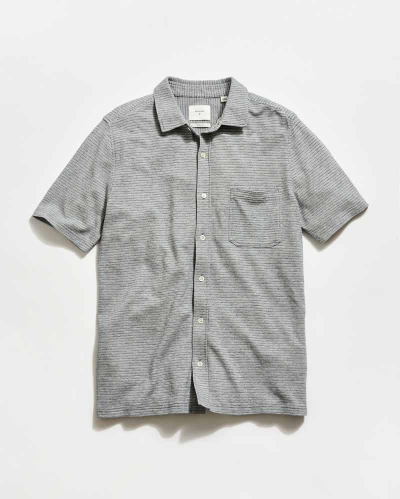 Gray striped short-sleeve shirt on a light gray background