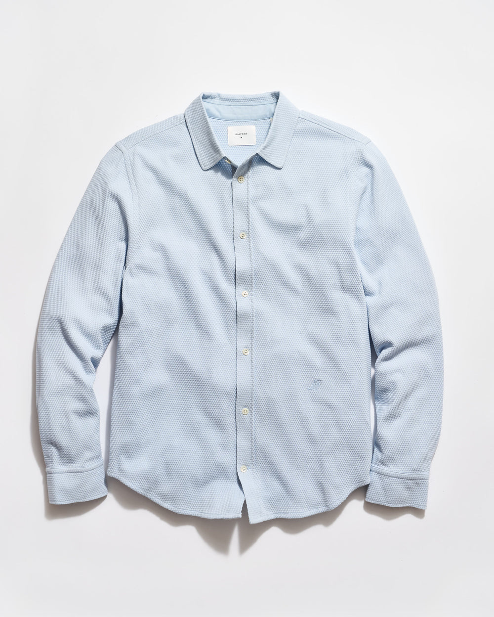 Light blue button-up shirt on a white background