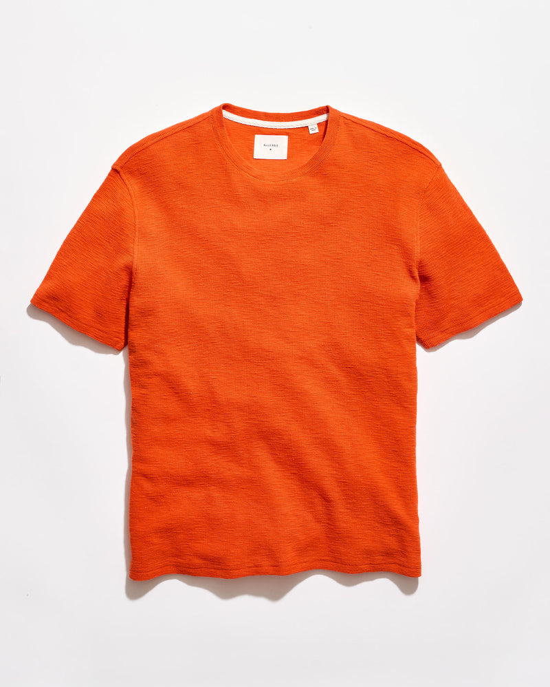 Orange t-shirt on a white background