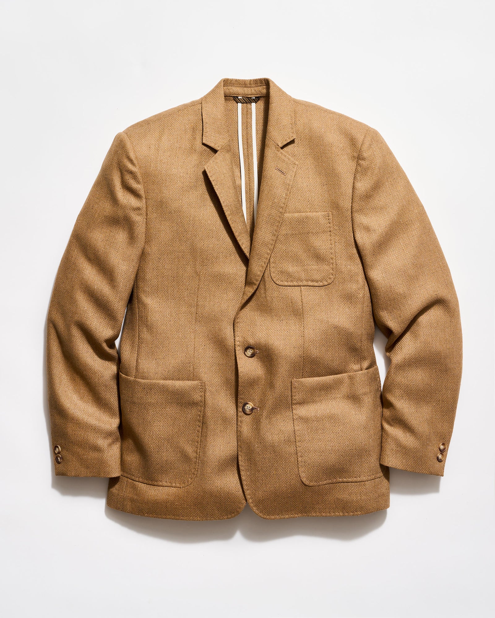 Brown blazer on a light gray background