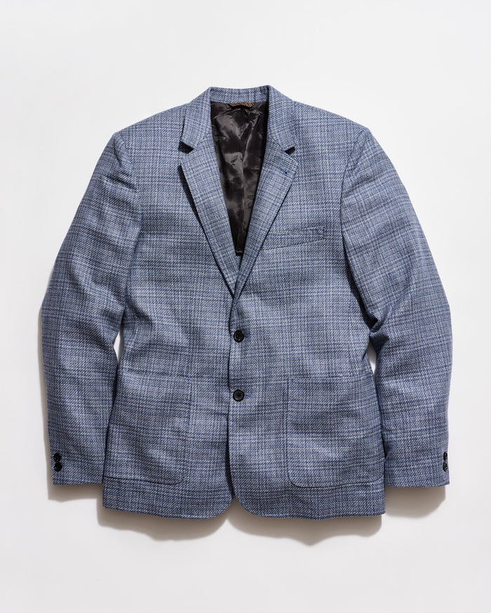 Blue checkered blazer on a light gray background
