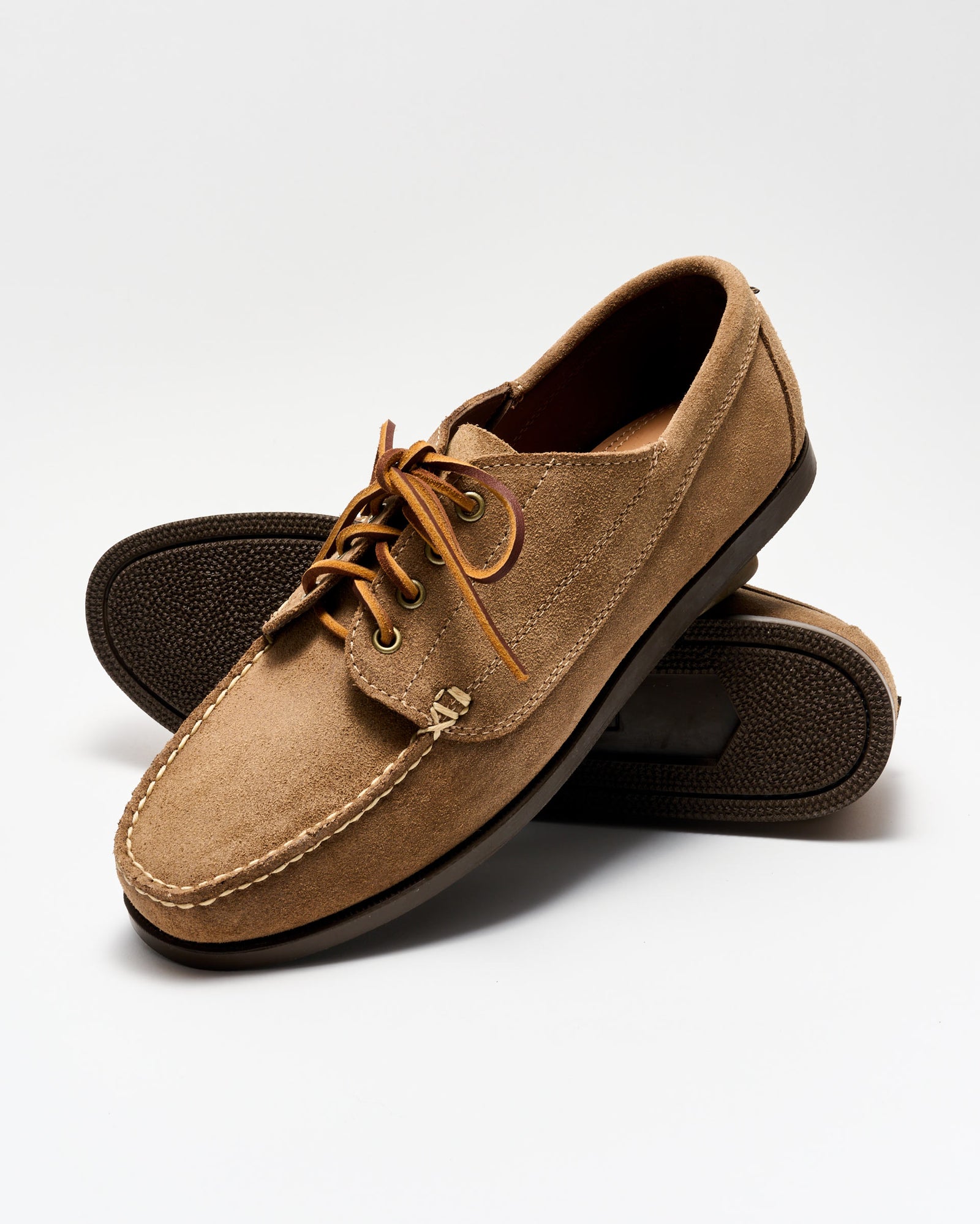 Pair of brown leather shoes on a white background