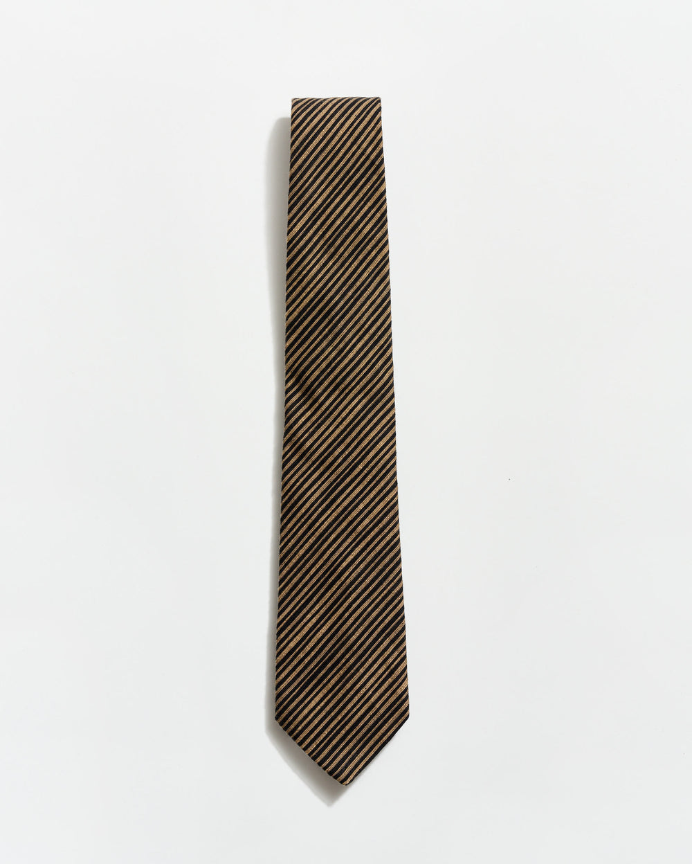 Striped tie on a light gray background