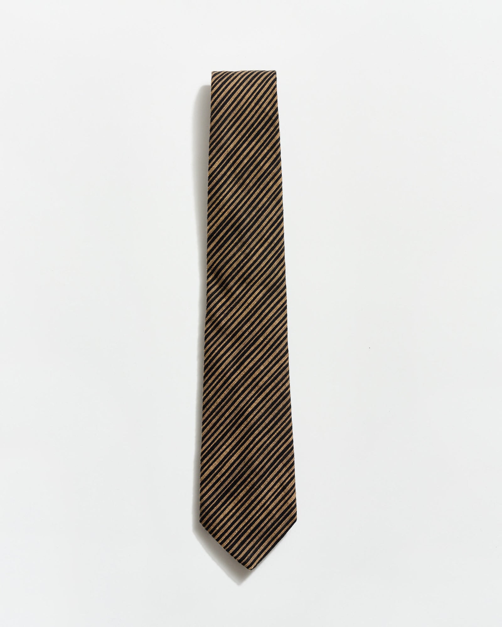Striped tie on a light gray background