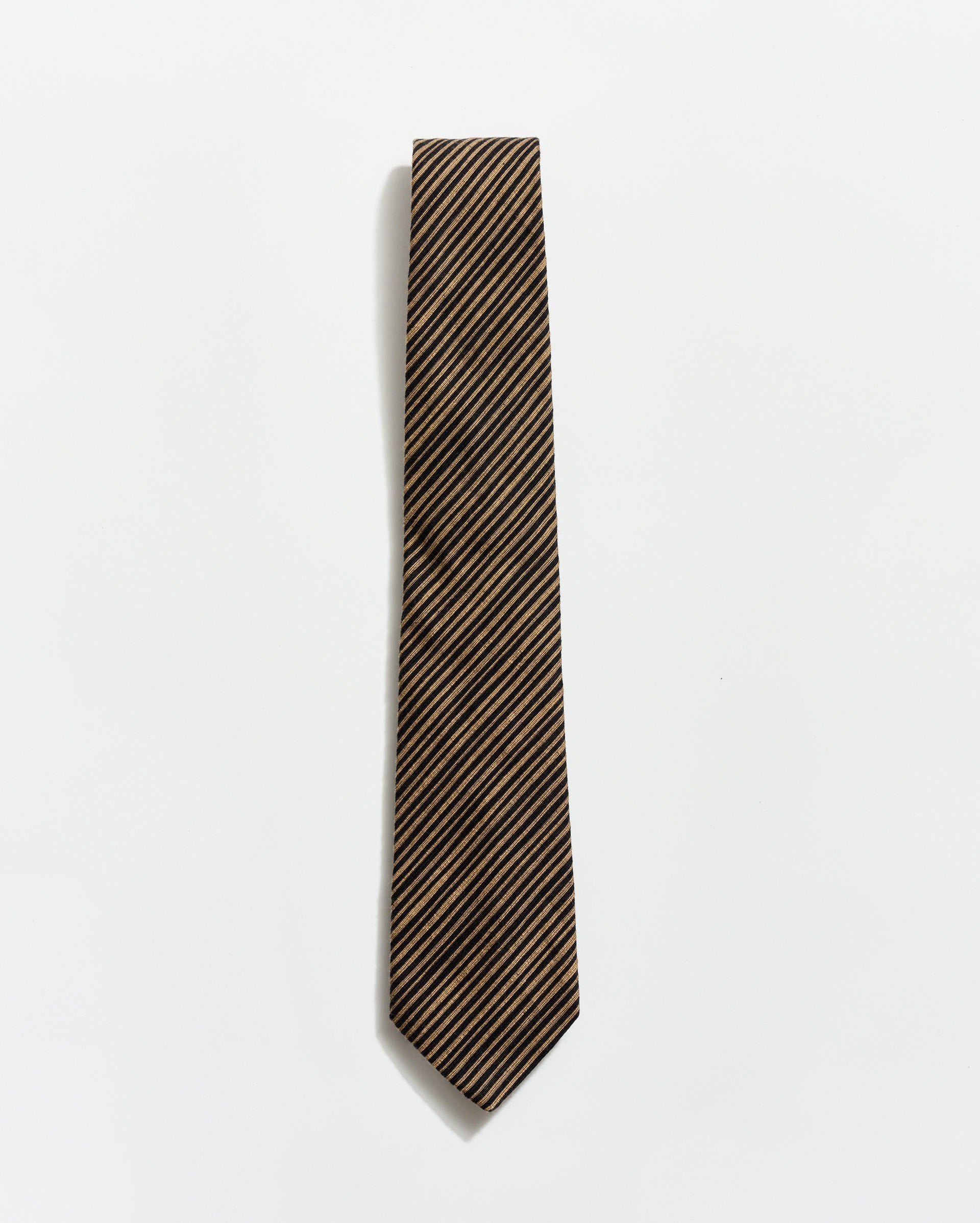 Striped tie on a light gray background