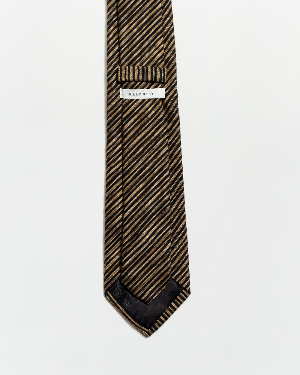 Striped tie with a brand label on a white background