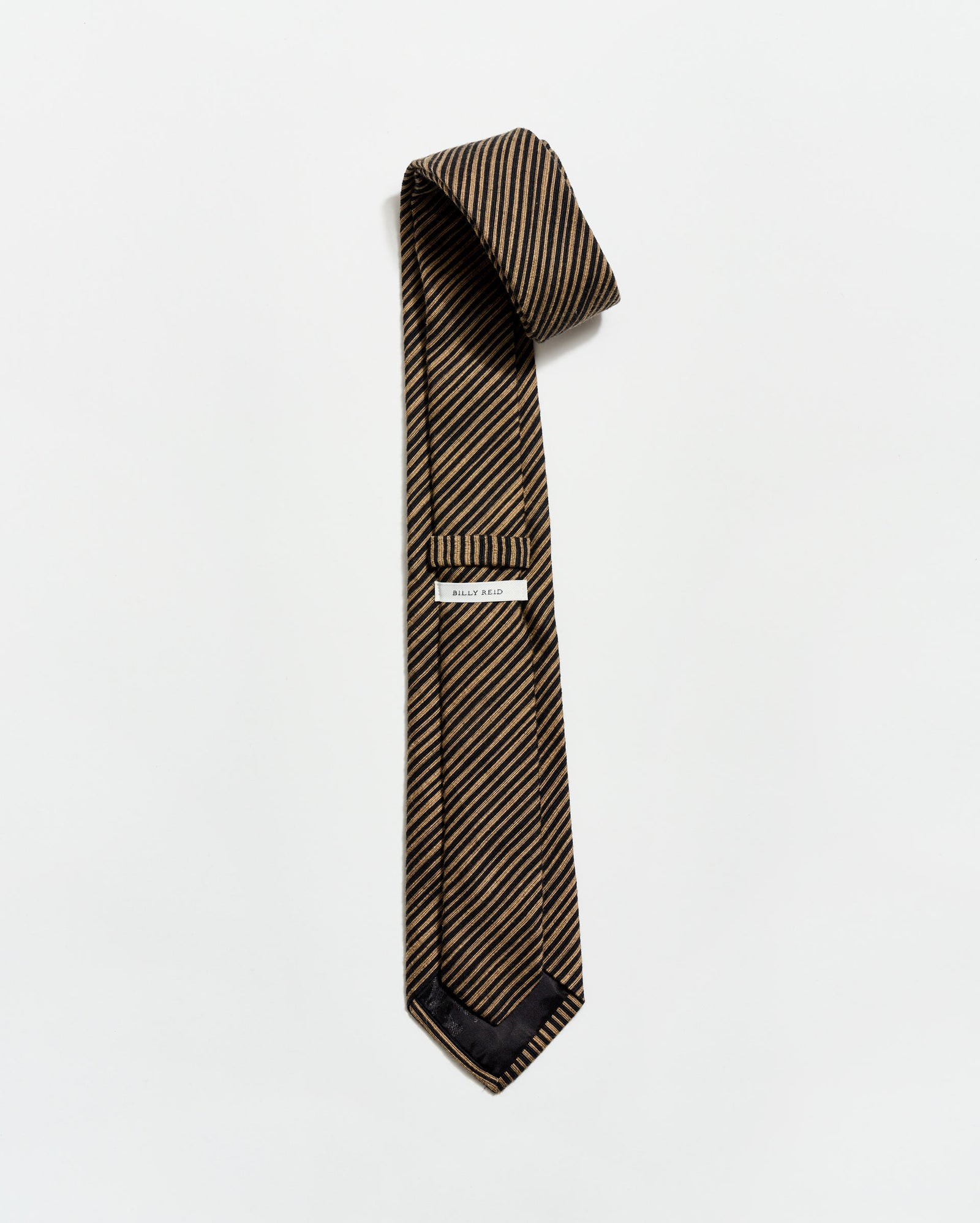 Striped tie with a pocket square on a white background