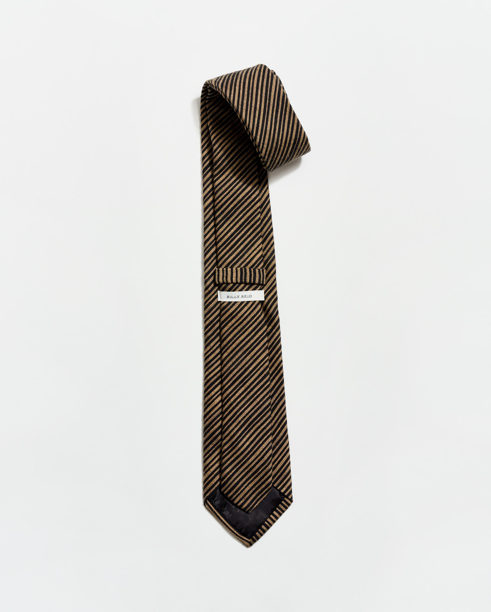 Striped tie with a pocket square on a white background