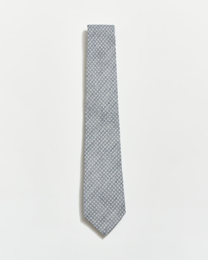 Gray patterned tie on a light gray background