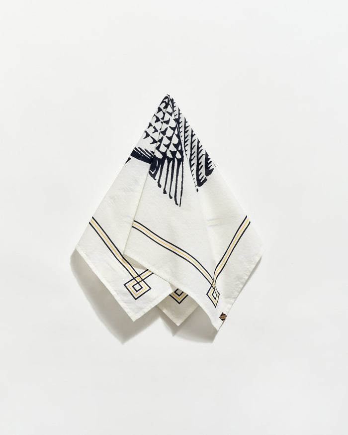 White napkin with black geometric pattern on a white background