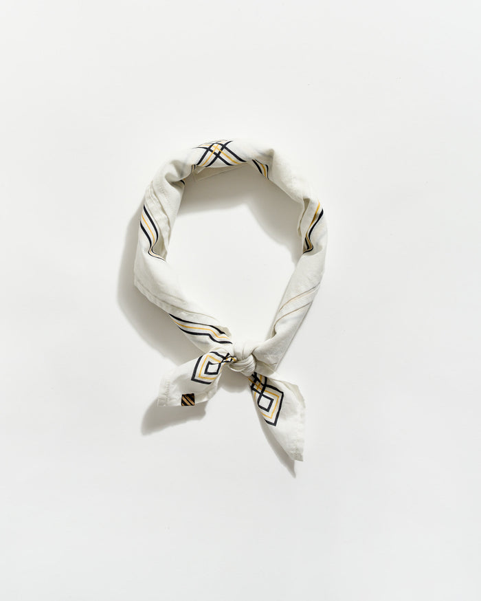 White bandana with black geometric patterns on a white background