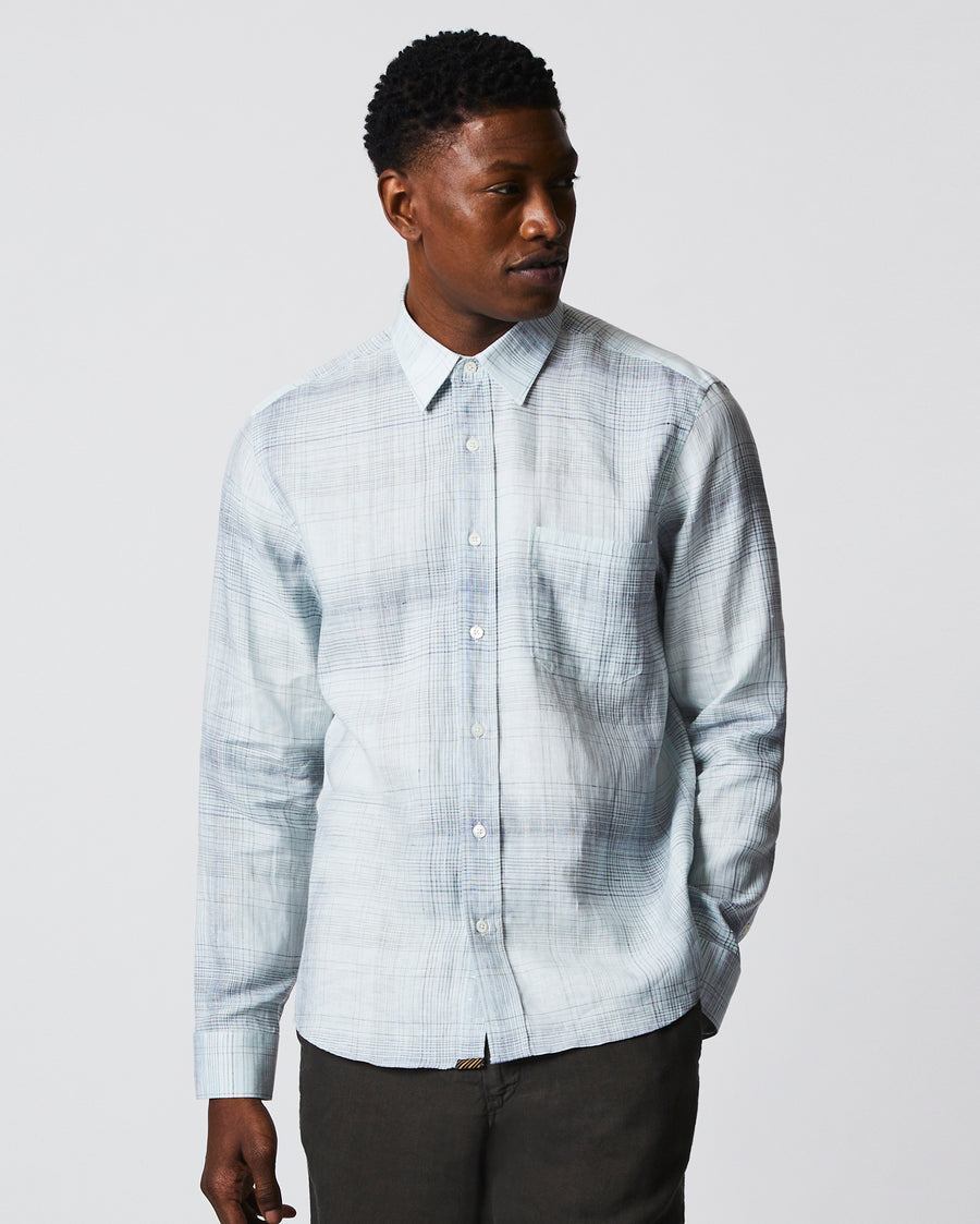 Male model wears the Tuscumbia Shirt in Limestone/Slate plaid