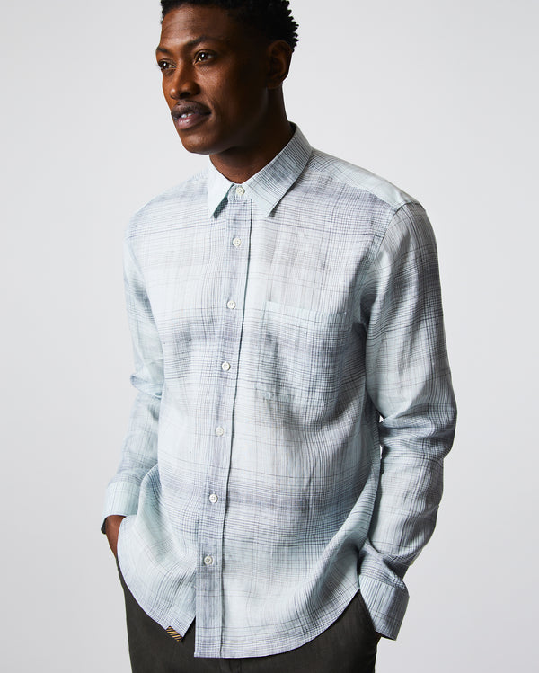 Male model wears the Tuscumbia Shirt in Limestone/Slate plaid