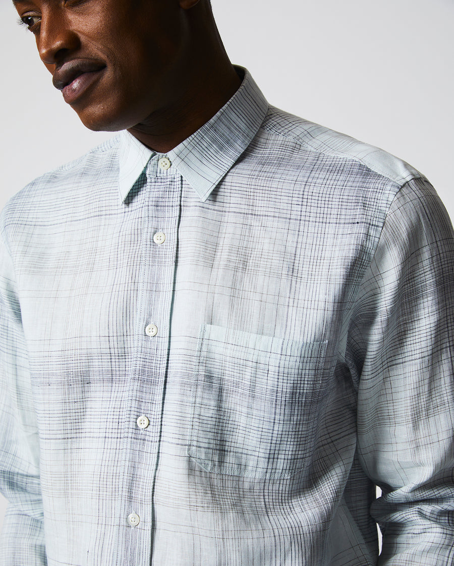 Male model wears the Tuscumbia Shirt in Limestone/Slate plaid