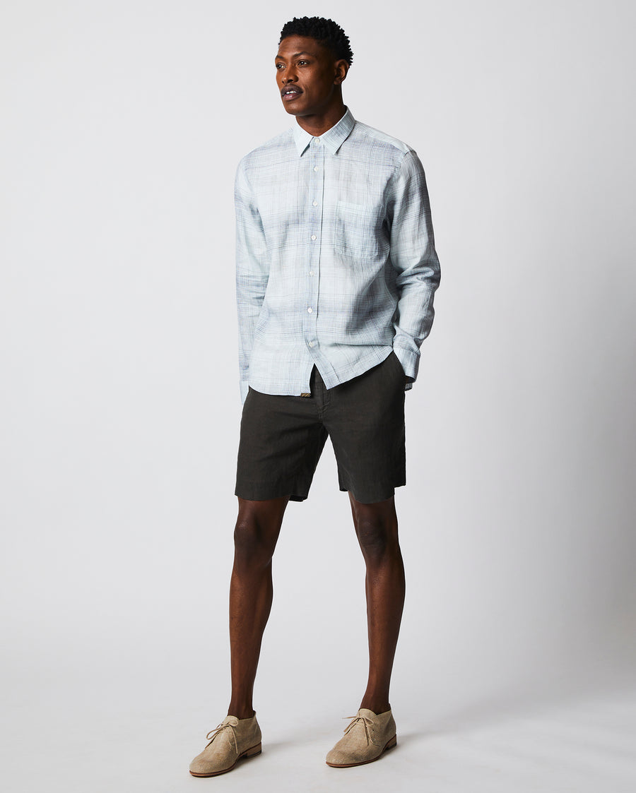 Male model wears the Tuscumbia Shirt in Limestone/Slate plaid