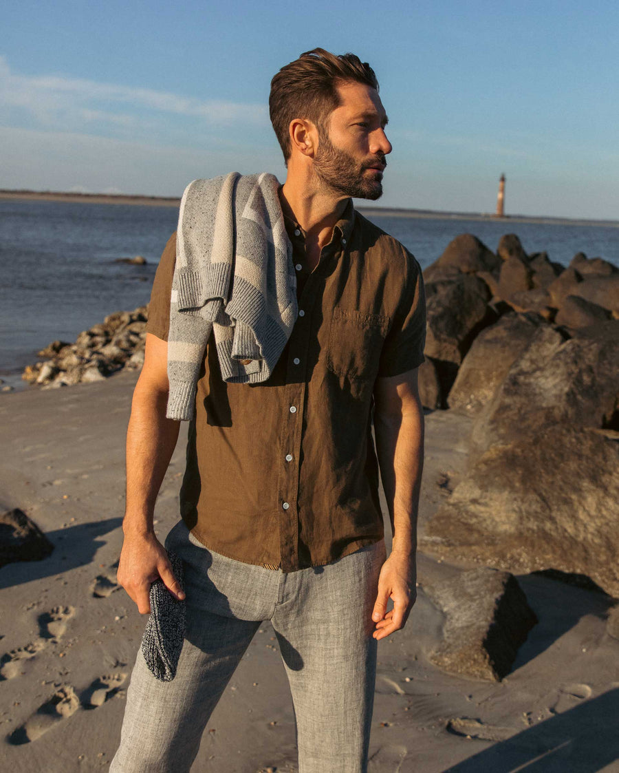 Male model wears the Short Sleeve Linen Tuscumbia Shirt Button Down in Military