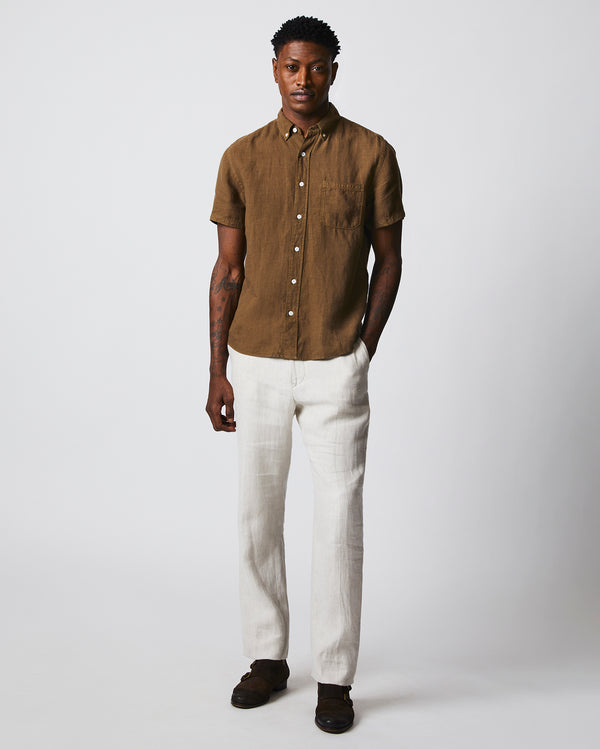 Male model wears the Short Sleeve Linen Tuscumbia Shirt Button Down in Military