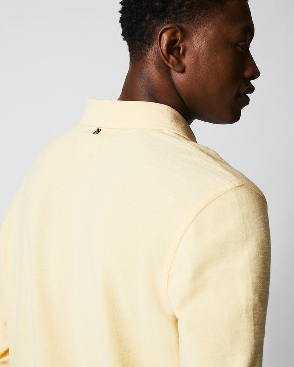 Male model wears the Long Sleeve Terry Rugby Polo in Pale Yellow
