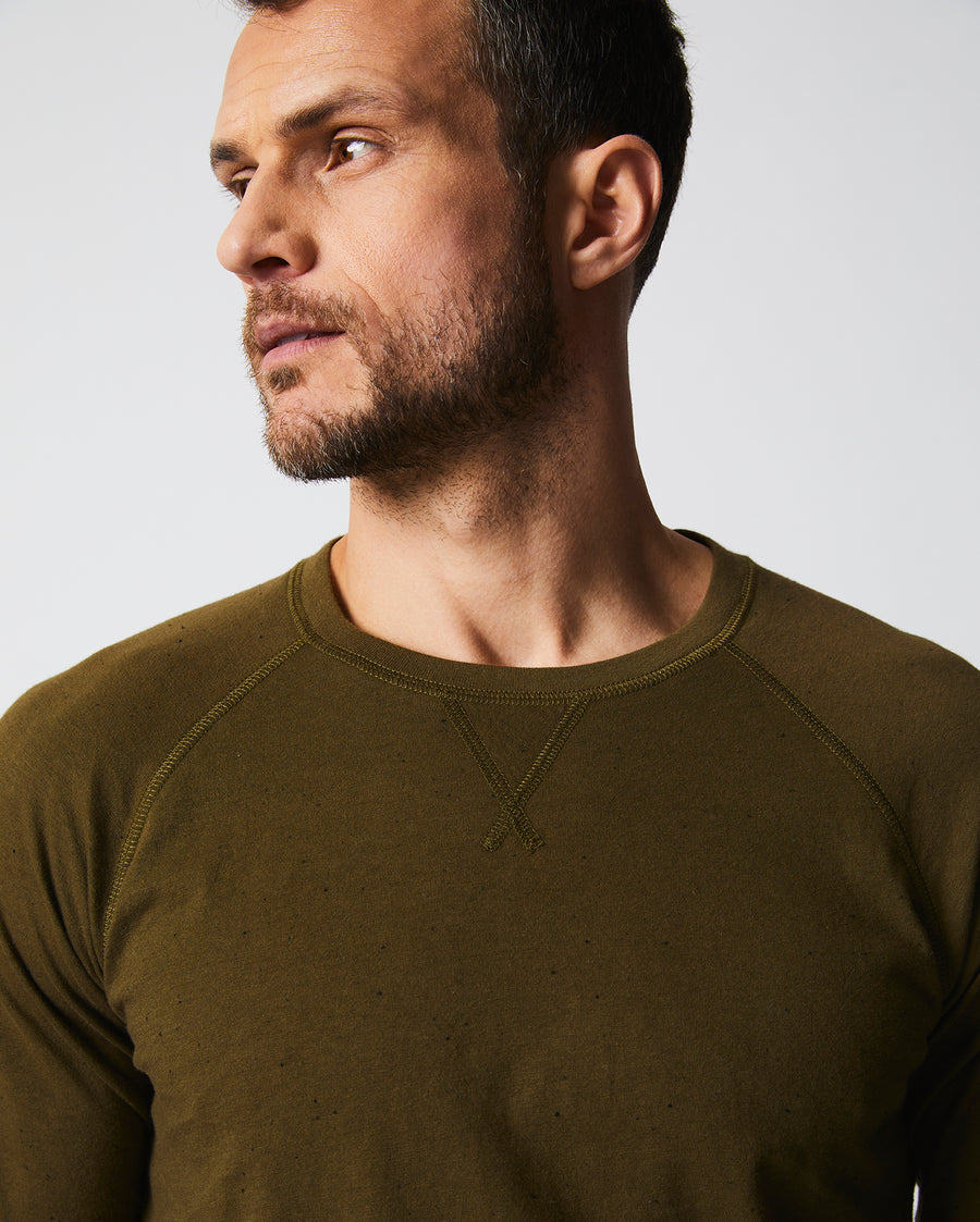 Male model wears the Donegal Crew Neck in Olive