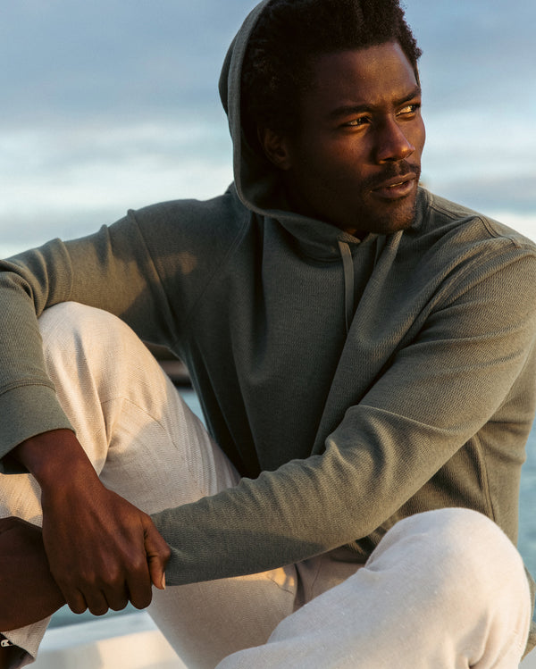 Male model wears the Thermal Hoodie in Slate Green