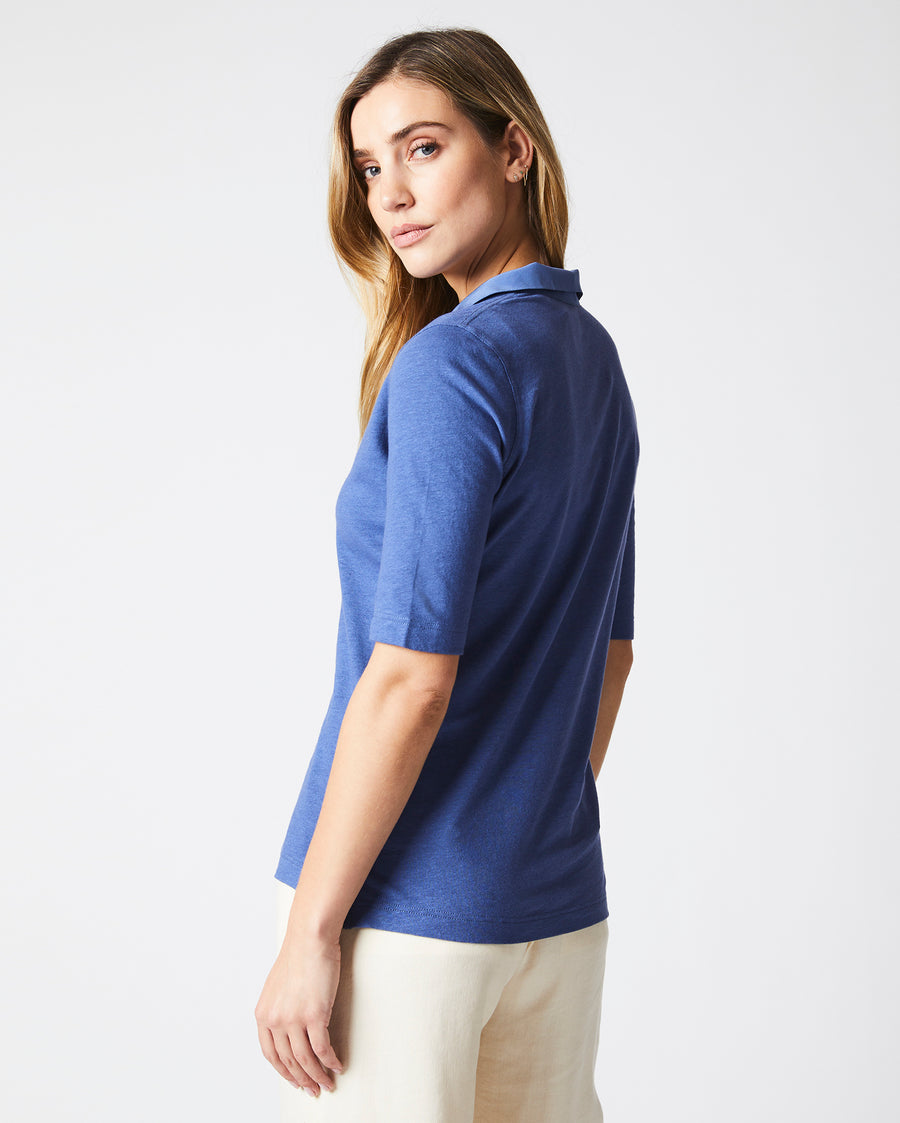 Female model wears the polo knit in Coastal Blue
