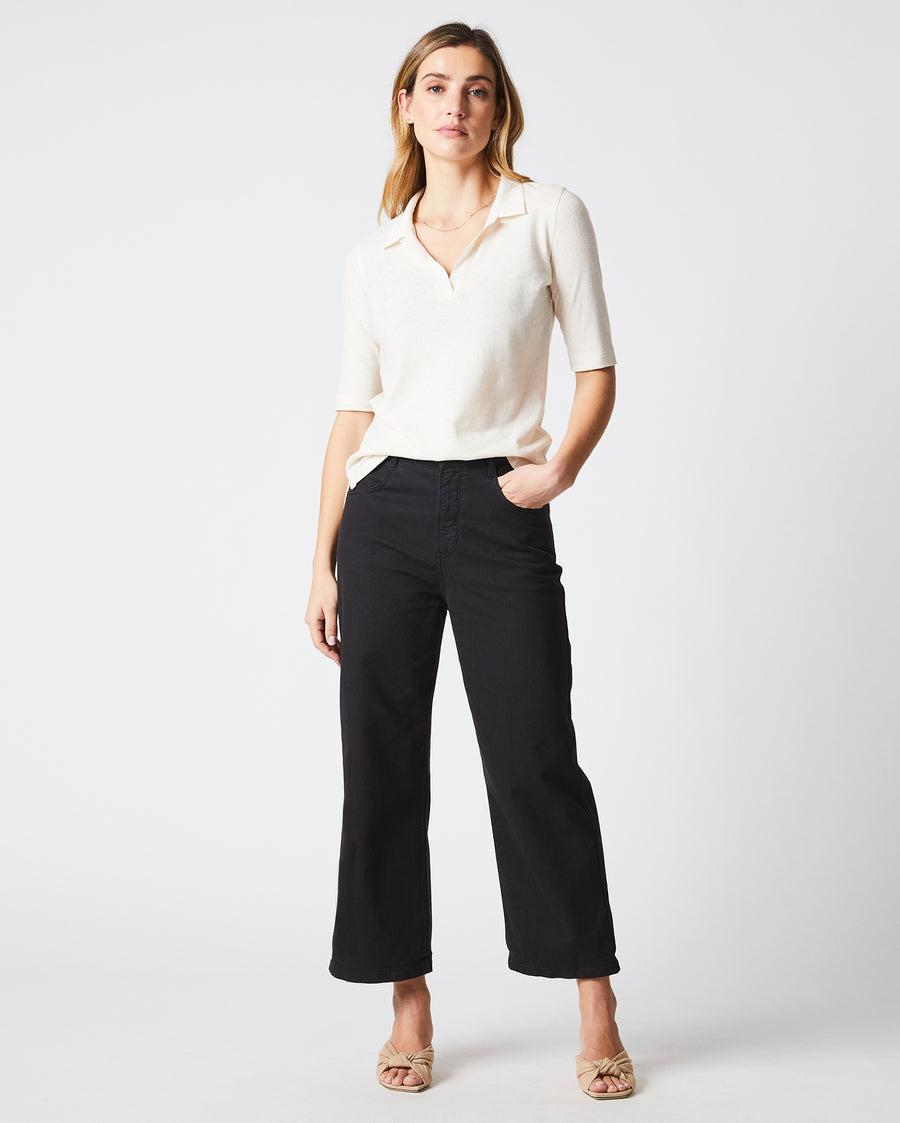 Female model wears the polo knit in White