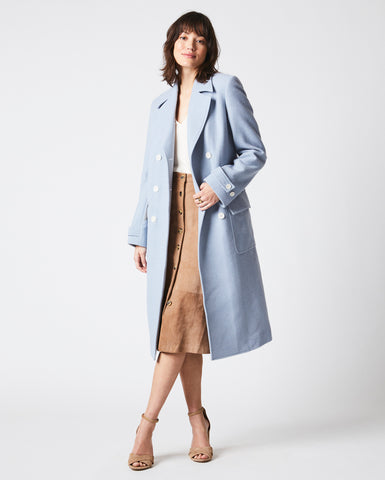 Female model wears the Macdougal Coat in Light Blue