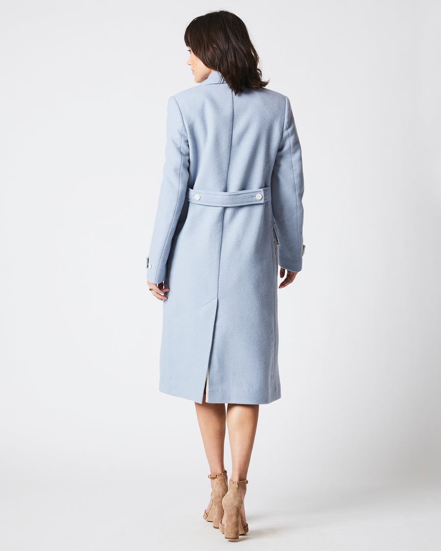 Female model wears the Macdougal Coat in Light Blue