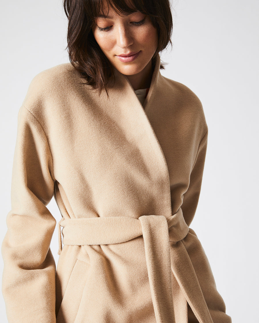Female model wears the Camille Wrap Coat in Camel