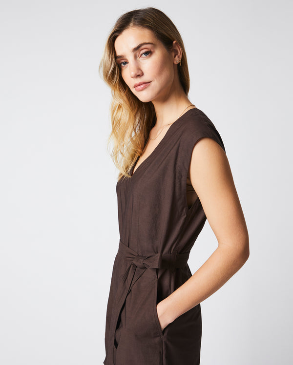 Female model wears the Jumpsuit in Chocolate