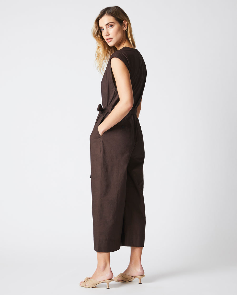 Female model wears the Jumpsuit in Chocolate