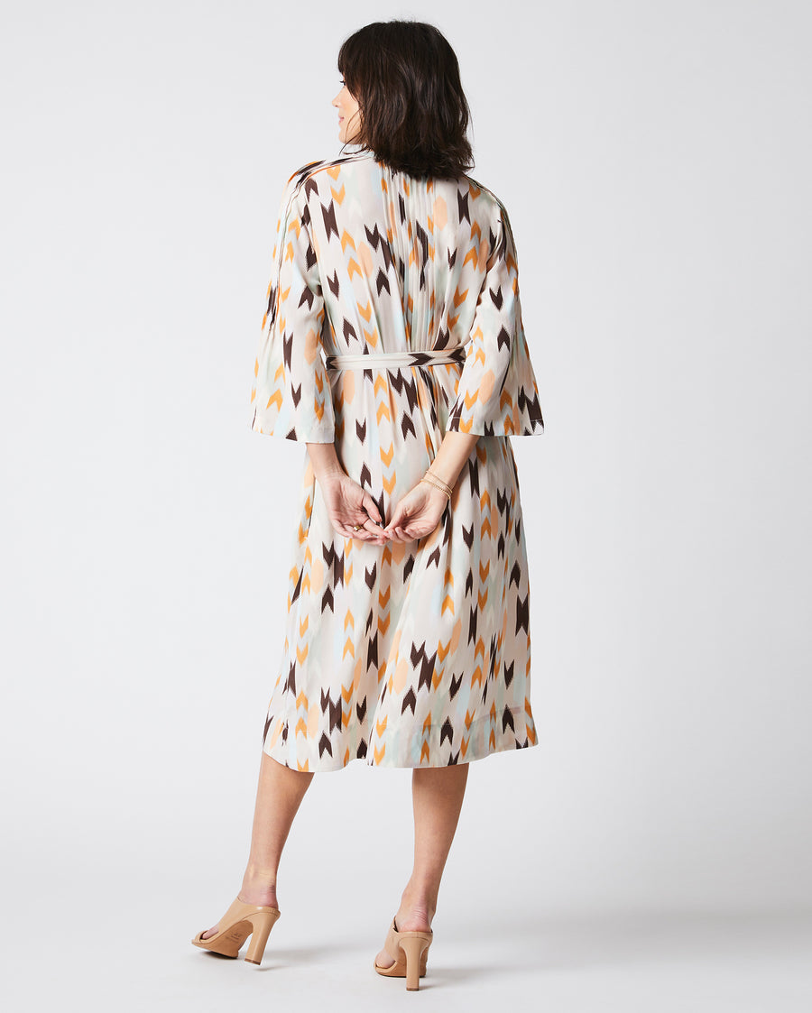 Female Model wears the Silk Pleated Shirt Dress Print